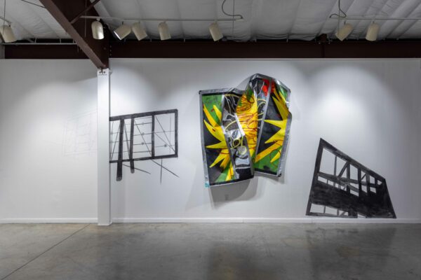 Installation view of paintings on tarp draped on a wall with metal armatures and graphite wall drawings