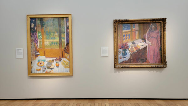 Installation view of two paintings of interiors