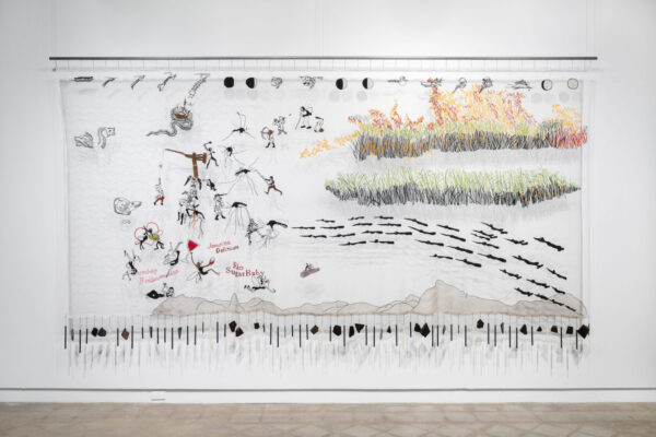 Installation view of an embroidered landscape on scrim