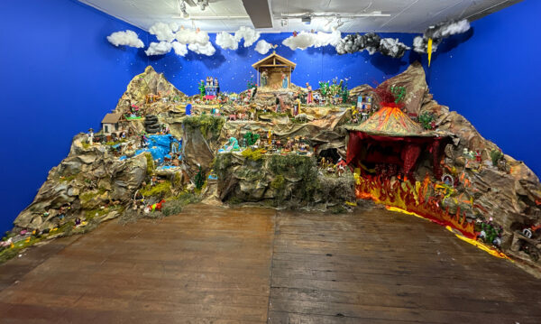 A photograph of a large sprawling nativity scene made up for over 400 small sculptures and figures.
