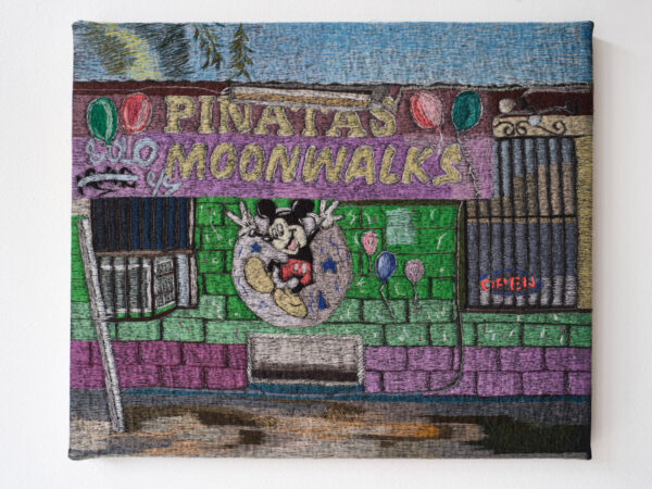 A textile work by Erick Medel featuring the exterior of a piñata store.