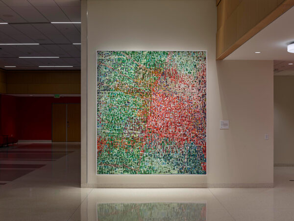 An installation image of a large scale abstract painting by Rick Lowe.