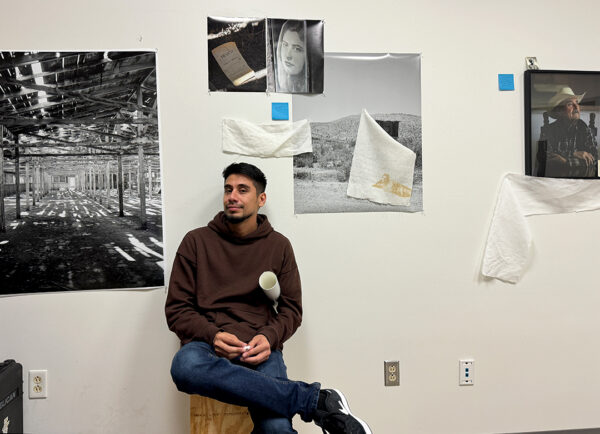 A photograph of artist Raul Rodriguez in his studio.