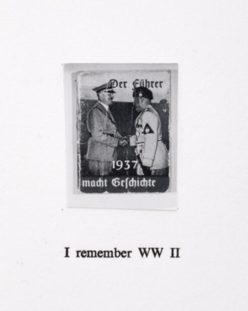 photo of a work with black and white photo of a man shaking hitler's hand with text under saying "I remember WW II"