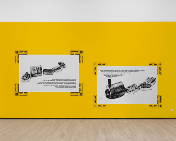 Two wheatpasted prints on a yellow wall