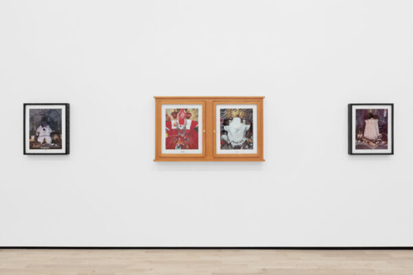 Installation view of three photos on a wall