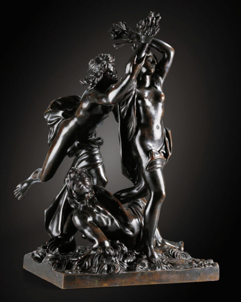 bronze sculpture of three figures