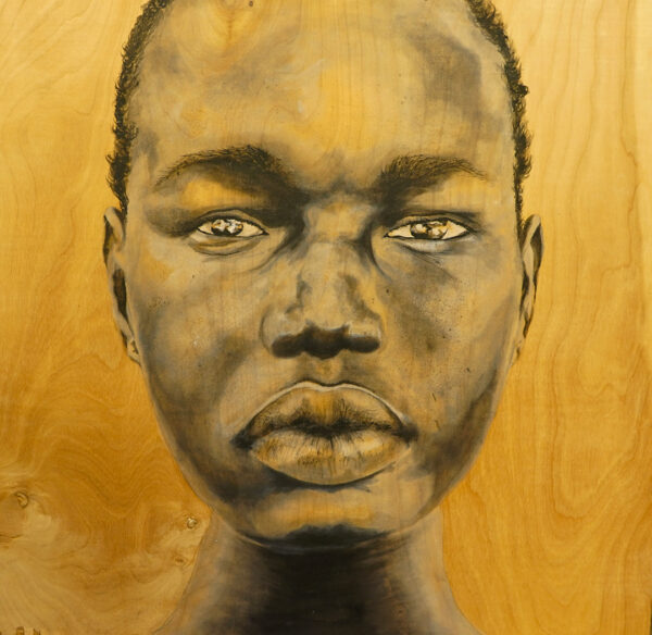 A portrait of a Black person made on a wood panel.