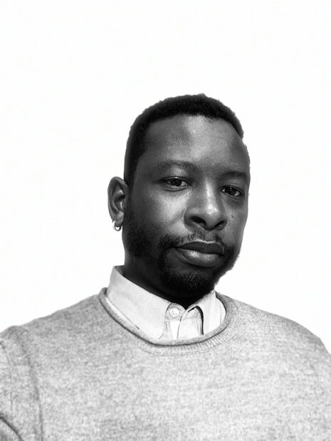 A black and white headshot of curator and art historian Phillip Townsend.