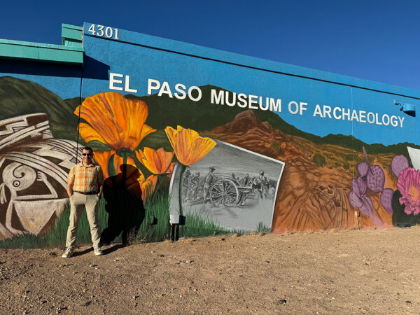 A photograph of director Sebastián Ribas-Normand standing outside of the El Paso Museum of Archaeology.