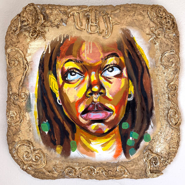 A photograph of a self portrait by Tiara Unique Francois set in a gold frame with the letters "TUF" at the top.