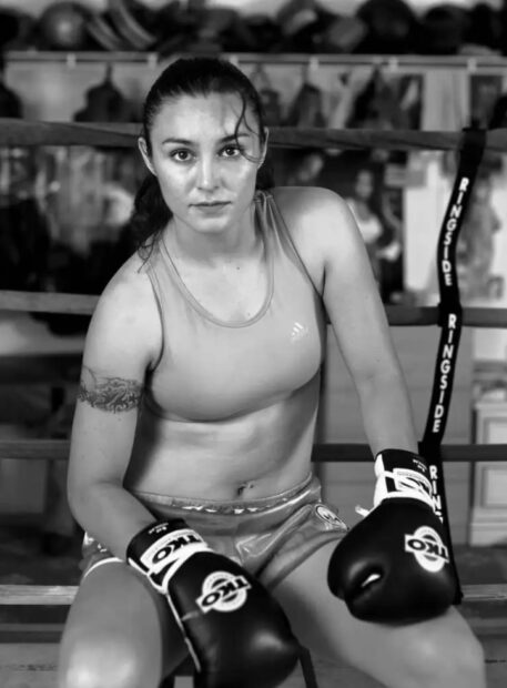 A black and white photograph of a female boxer by Delilah Montoya.
