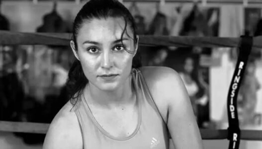 A black and white photograph of a female boxer by Delilah Montoya.