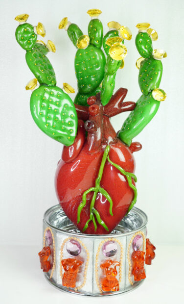 Sculpture of a ceramic cactus growing from a red heart
