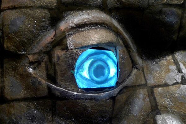 Detail of video projection of an eye on a sculpture