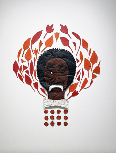 A mixed-media work of art by Alicia Henry featuring a Black person's face surrounded by red leaves.