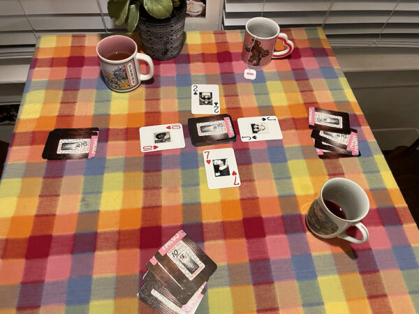 Installation photo of a card game on a kitchen table