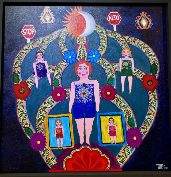 Photo of a small painting of a tree of life of women against a blue background
