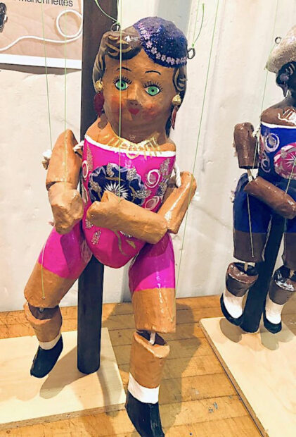 Installation detail of a marionette doll