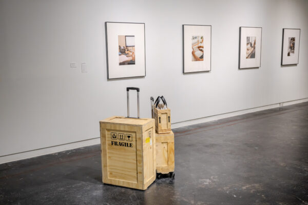 Installation view of luggage made of art crates