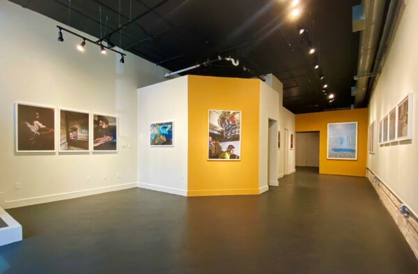 Installation view of large photos in a gallery