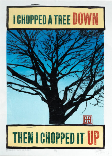A print of a bare tree. The text reads: I chopped a tree DOWN. Then I chopped it UP.