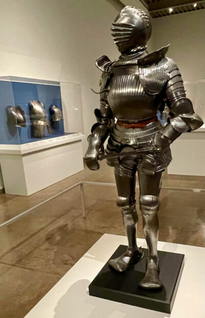 Installation shot of a suit of armor on view at a museum