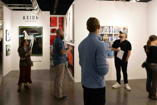 View of visitors looking at work in the booths at Affordable Art Fair