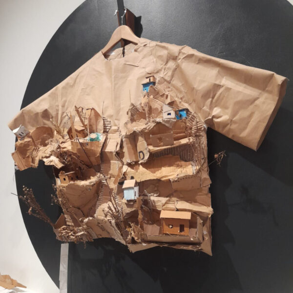 Cardboard jacket with landscapes cut out