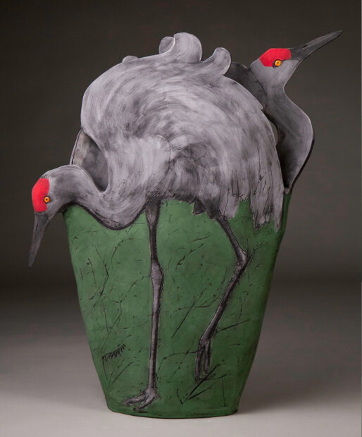 A photograph of a sculpture by Debra Chronister featuring two sandhill cranes. 