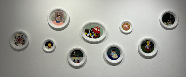 An installation photograph of a paintings by Fernando Andrade on Styrofoam plates.