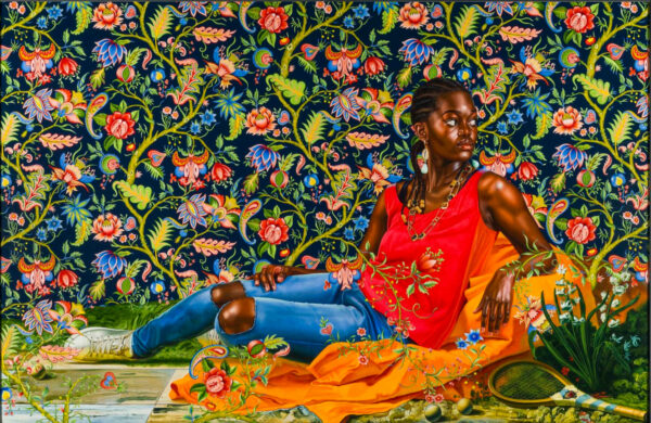 Image of a black girl seated in a semi-reclining pose surrounded by a backdrop of flowers