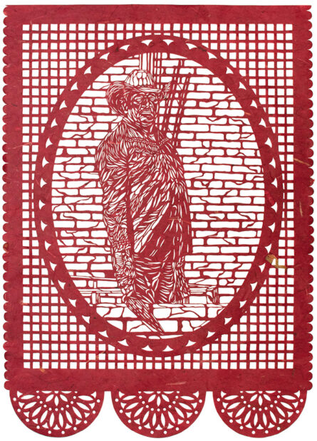 A photograph of a intricately cut paper portrait of a masonry worker. 