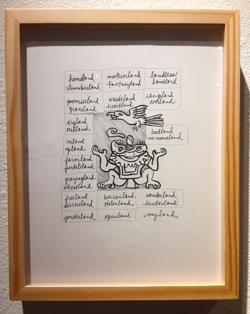 A small framed drawing with handwritten text phrases.