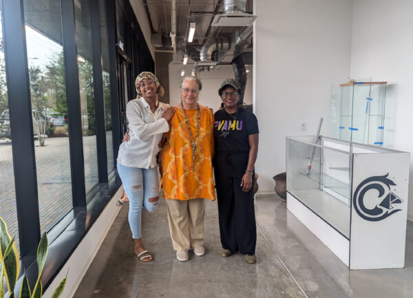 A photograph of Community Artists' Collective staff Tamirah Collins, Michelle Barnes, and April M. Frazier.