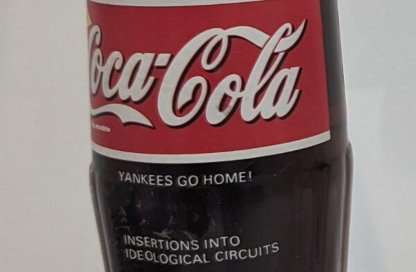 A Coca-Cola bottle with the phrase "YANKEES GO HOME! affixed in Letra-set letters.