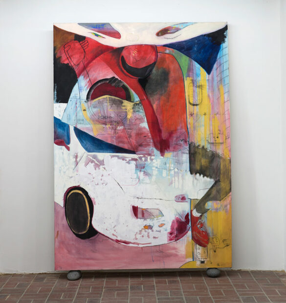 A large abstract painting partially depicting a white car sits on the floor of a gallery leaning against the wall.