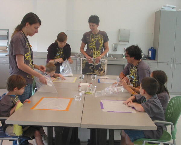 A photograph of artist and educator Terri Thornton leading a program in a studio.