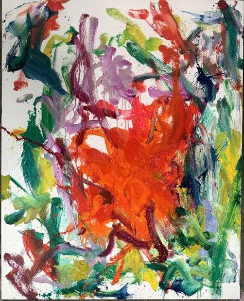 A non-figurative abstract painting with an orange tangle of brushstrokes at the center and green brushwork around the edges.