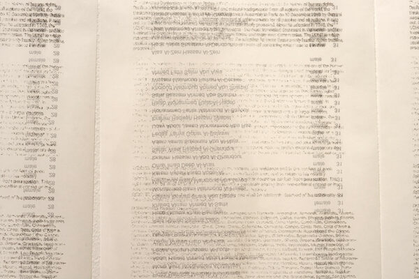 A sheet of paper with names printed in reverse.