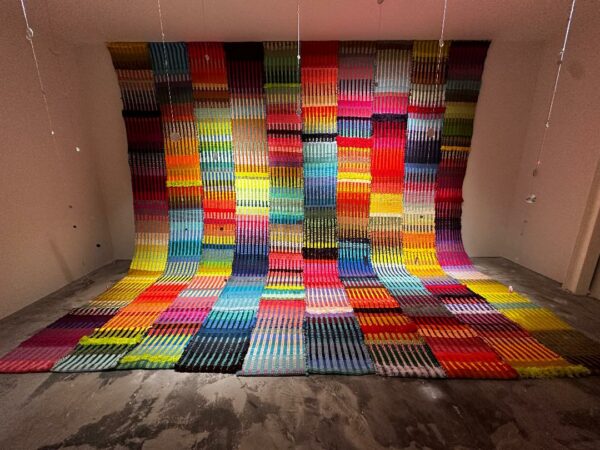 An installation image of a large fabric work by Molly Margaret Sydnor.