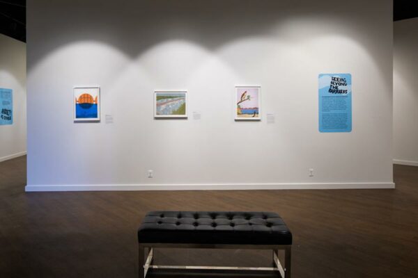 An installation image of artworks on a gallery wall.