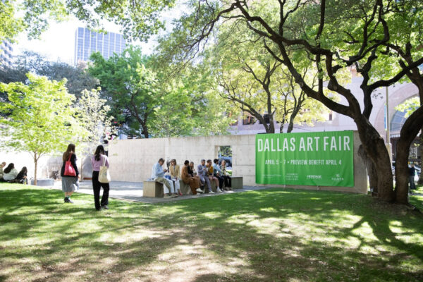 A photograph of a sign outside of the Dallas Art Fair promoting the event.