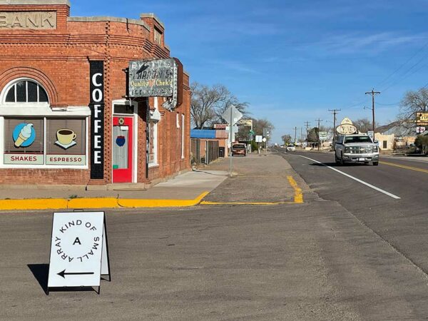 A small town street with old brick buildings.