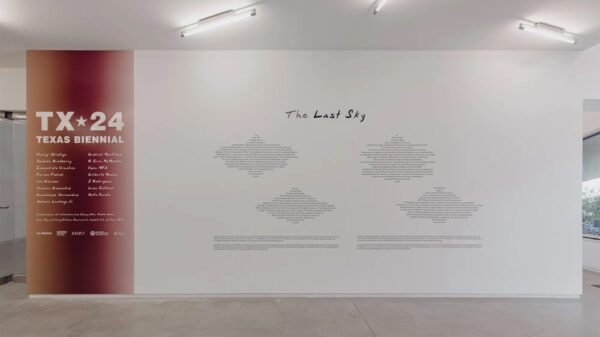 Wall text reads TX 24 Texas Biennial, and lists names of artists included in a group art exhibition. 