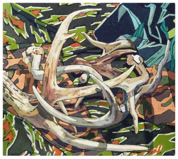 A painting of deer antlers on a camouflaged cloth.