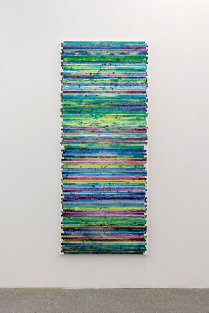 A colorful painting of films strips attached to a canvas.
