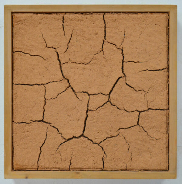 A square frame with brown mud and adobe.