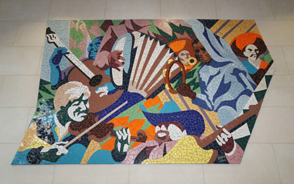 A mosaic mural by John Yancey featuring imagery related to the Texas music scene.