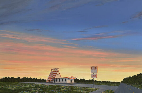 A landscape at dusk with a Whataburger restaurant in the foreground.